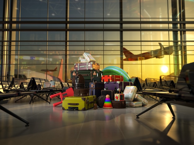 Equipaje para niños en la sala de salidas vacía en el aeropuerto en luces del atardecer