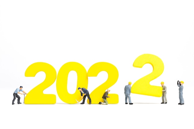 Equipe de trabalho de pessoas em miniatura número de compilação 2022, conceito de feliz ano novo