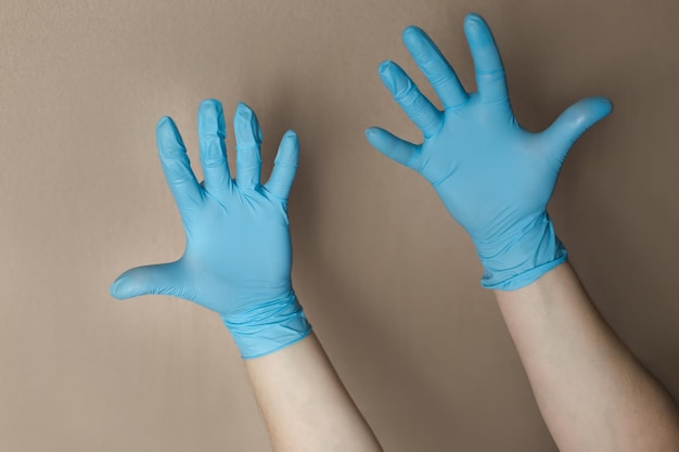 Equipo de protección personal guantes desechables de vinilo azul contra la propagación del virus y prote