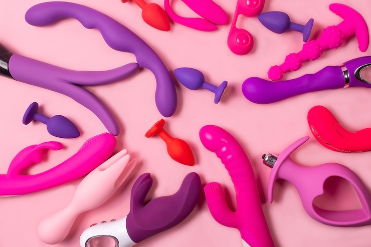 Foto erwachsen ein spielzeug auf einem rosa hintergrund, sex-set