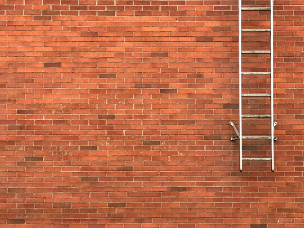 Foto escadas de saída de segurança na parede de tijolos