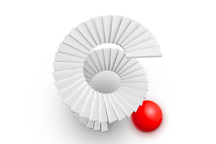 Foto escalera de caracol y esfera roja sobre fondo blanco.