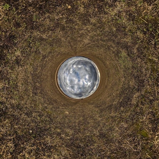 Esfera azul pequeno planeta dentro do fundo do quadro redondo de grama verde
