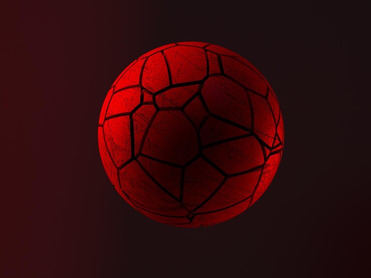 Foto esfera vermelha com rachaduras em um fundo marrom.