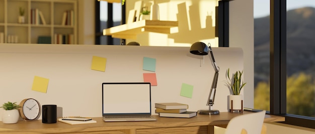 Espacio mínimo de coworking de oficina con maqueta de computadora portátil y suministros de oficina en la mesa