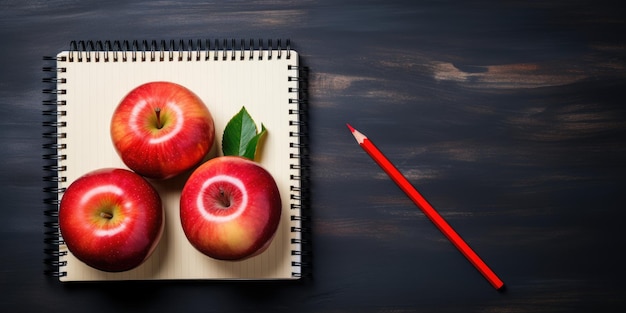 Espacio para texto regreso a la escuela Bloc de notas y manzana en la mesa Foto de alta calidad IA generativa