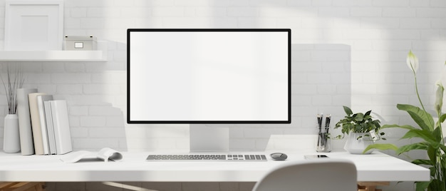 Espacio de trabajo blanco mínimo moderno con maqueta de computadora PC sobre la pared de ladrillo blanco