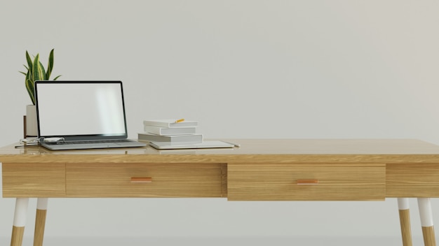 Foto espacio de trabajo diseñado con mesa de madera de pared blanca y maqueta de computadora portátil con pantalla en blanco y espacio de copia