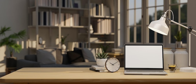 Espacio de trabajo con maqueta de computadora portátil y decoración en una mesa de madera en una sala de estar contemporánea