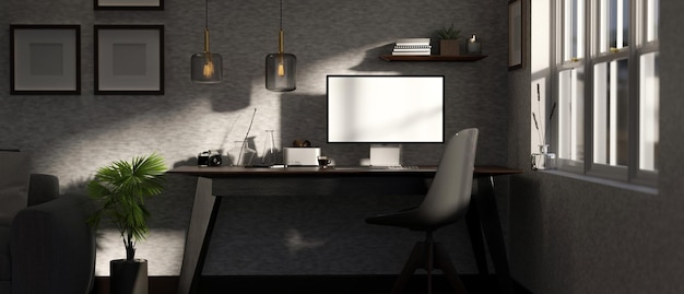 Espacio de trabajo de oficina de loft moderno en la sala de estar con computadora y accesorios en la mesa contra la pared gris