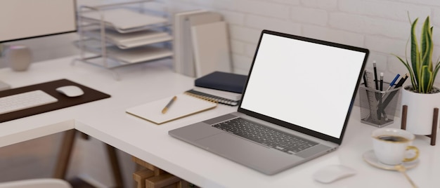 Espaço de trabalho de mesa de escritório moderno com maquete de notebook e material de escritório