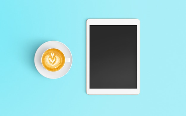 Espaço de trabalho moderno com xícara de café e tablet na cor azul