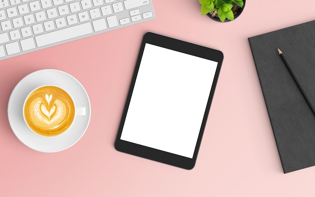 Espaço de trabalho moderno com xícara de café, notebook, teclado e smartphone na cor rosa