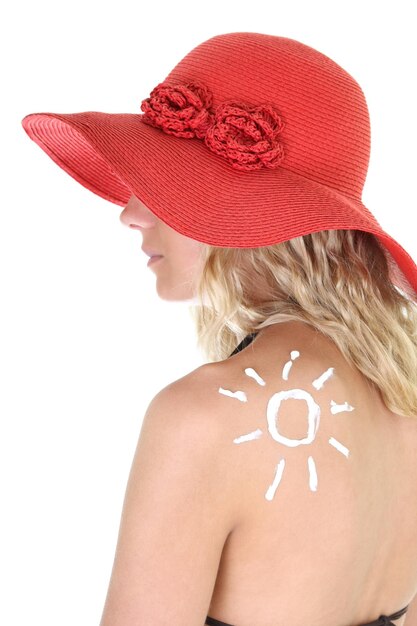 Espalda de mujer con signo de sol sobre blanco