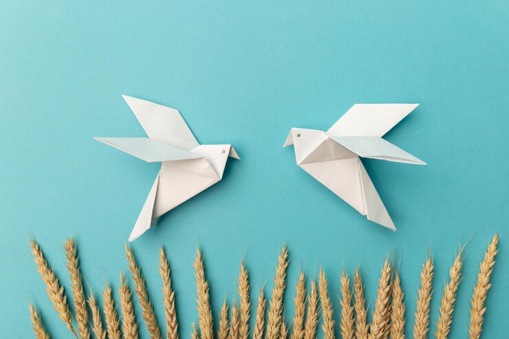 Foto espigas de trigo y dos pájaros blancos como símbolo de paz en un fondo azul no hay guerra