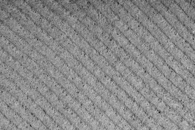 Esponjas de limpeza doméstica closeup Esponja detalhe textura textura de esponja close-up fundo Textura de esponja de celulose Malha de arame no fundo da superfície da esponja Preto e branco