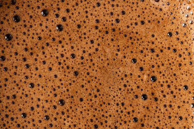 Espuma de café marrón con vista superior bubles