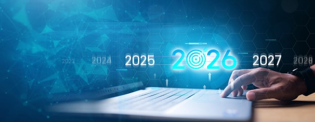 Establecimiento de objetivos en 2026 Empresario tocando la barra de progreso de 2025 a 2026 Nueva puesta en marcha de negocios