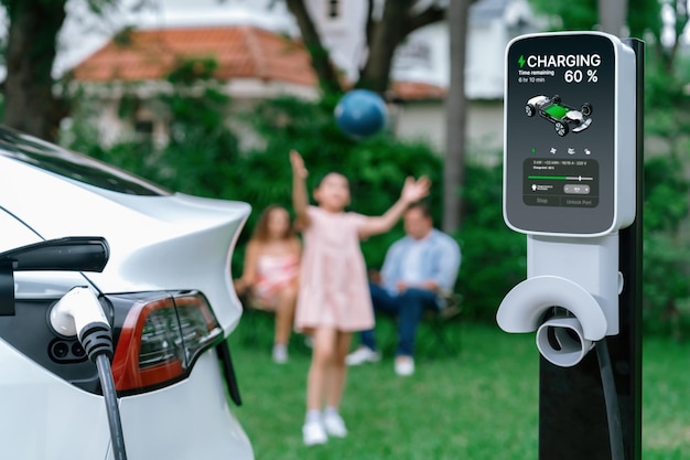 Foto estación de recarga de baterías para automóviles eléctricos en la familia synchronos borrosa