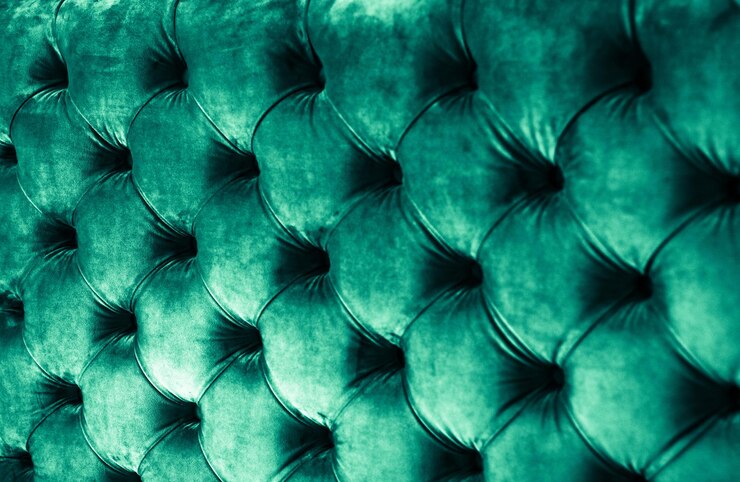 Foto estofamento de sofá acolchoado de veludo de luxo esmeralda com botões, textura e fundo de decoração verde elegante