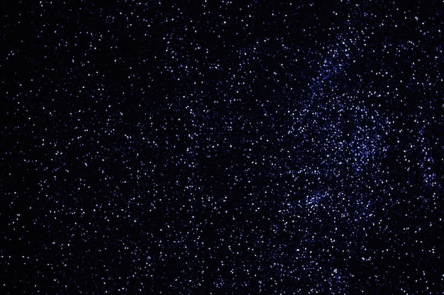 Foto estrelas azuis no céu do espaço luzes azuis desfocadas partículas brilhantes fundo abstrato
