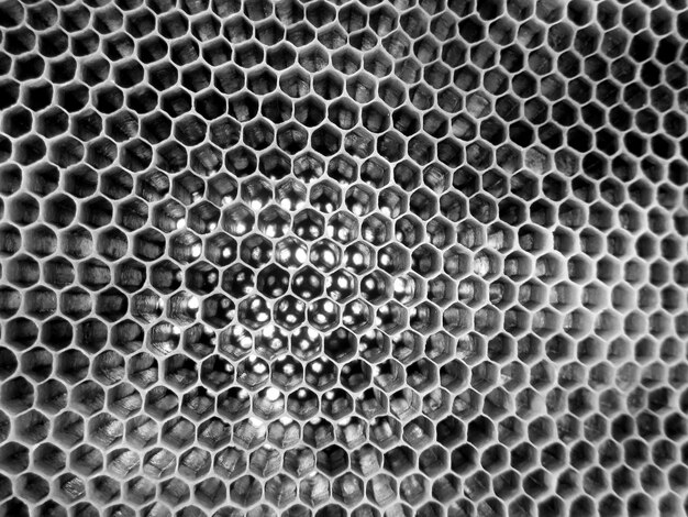 Foto estrutura hexagonal abstrata é um favo de mel da colmeia de abelhas