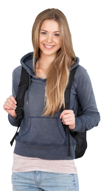 Estudante sorridente em pé com a mochila - isolada