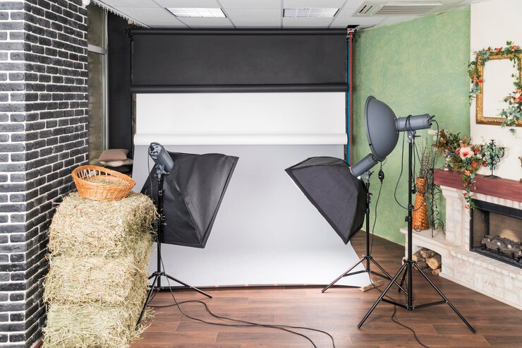 Foto estúdio interior com equipamento de estúdio conectado, iluminação e fundos de papel