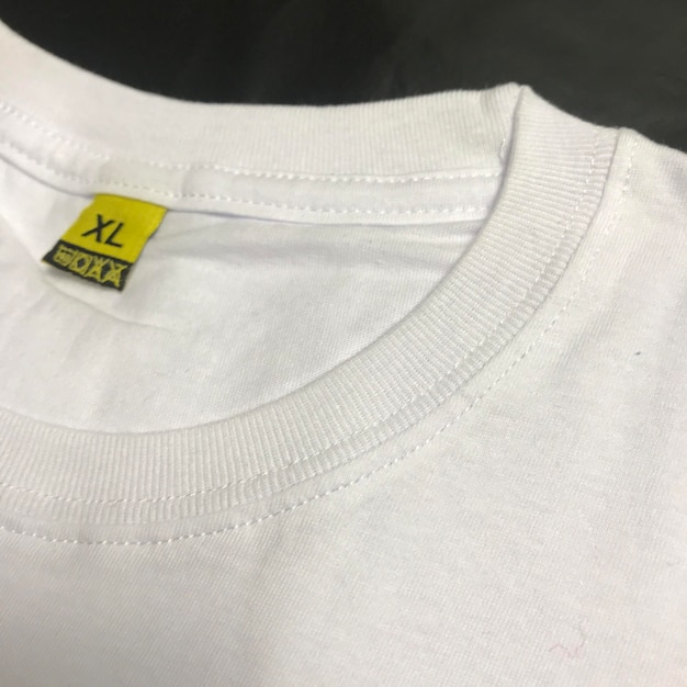 Foto etiqueta de tamanho de camiseta em imagem de close-up foto de moda de tecido