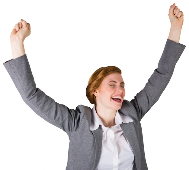 Excited redhead businesswoman cheering