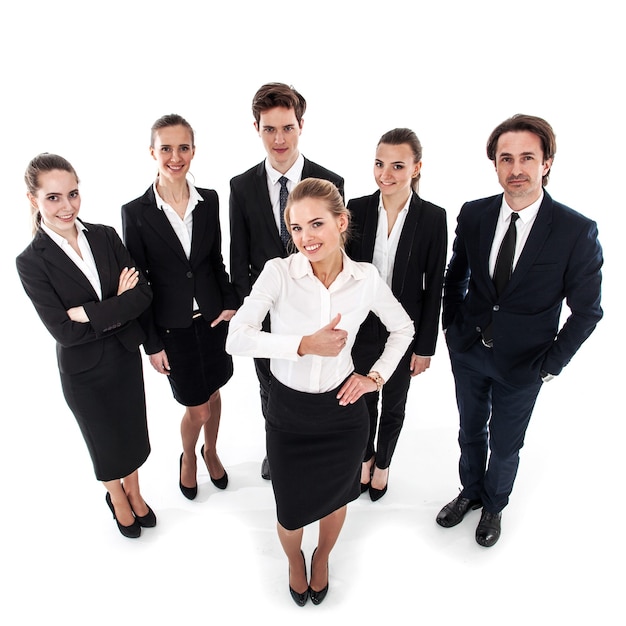 Exitosa mujer de negocios joven mostrando Thumbs up sign y su equipo aislado sobre fondo blanco.