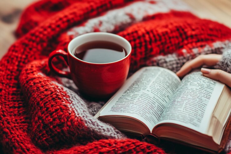 Experiencia de lectura acogedora con una bebida caliente y una manta suave durante el invierno IA generativa