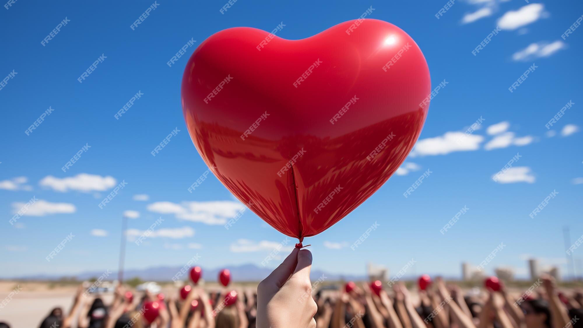 Experimenta la magia del día de san valentín con lanzamientos de globos en  forma de corazón crea momentos románticos inolvidables mientras la gente  libera globos llenos de amor en el cielo una
