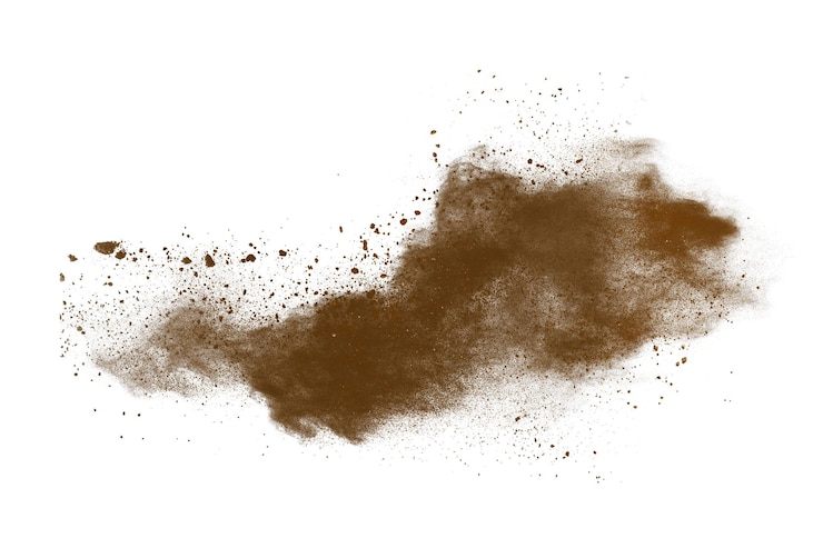 Foto explosão de pó castanho isolada em fundo branco