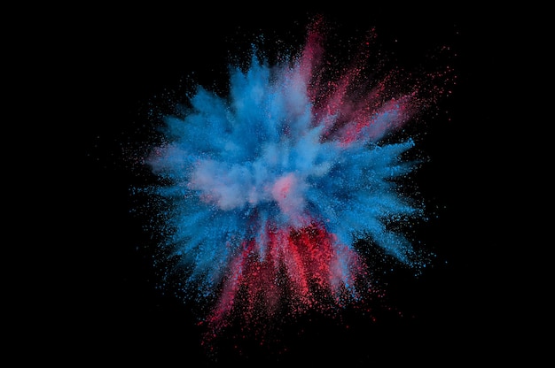 Foto explosão de pó colorido. pó de closeup abstrata no pano de fundo. explodir colorido. pintar holi