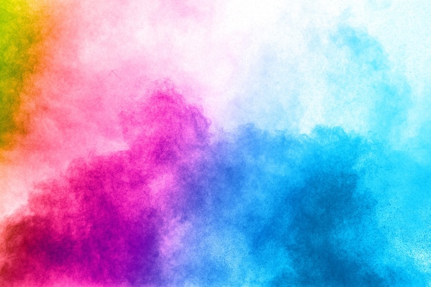 Foto explosión abstracta del polvo del color en el fondo blanco. movimiento congelado del chapoteo del polvo