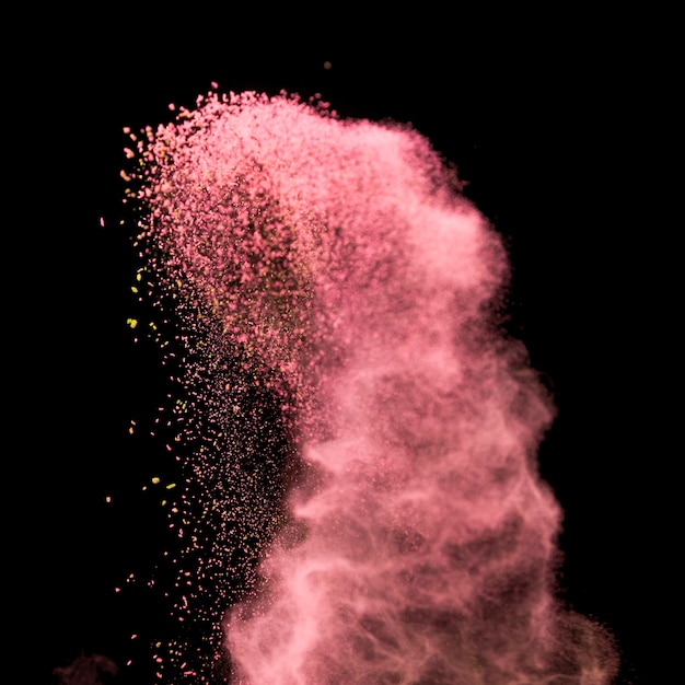 Foto explosión abstracta de polvo rosa