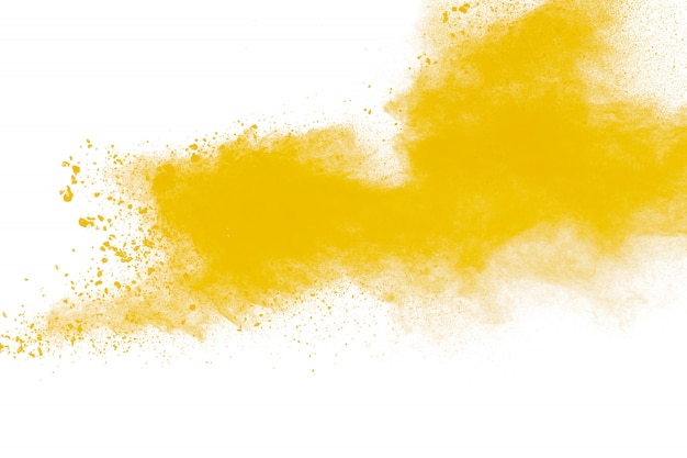 Explosión de partículas de polvo amarillo sobre fondo blanco. Salpicaduras de polvo de polvo amarillo.