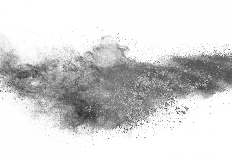 Foto explosión de polvo negro sobre fondo blanco.