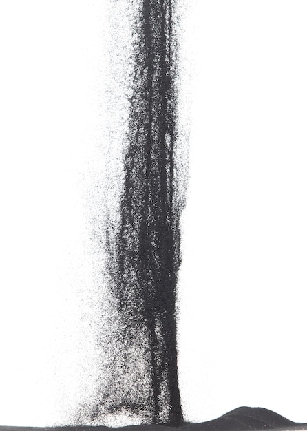Foto explosión de vuelo de arena de tamaño pequeño negro polvo de carbono granos de arena explotan mosca de nube abstracta