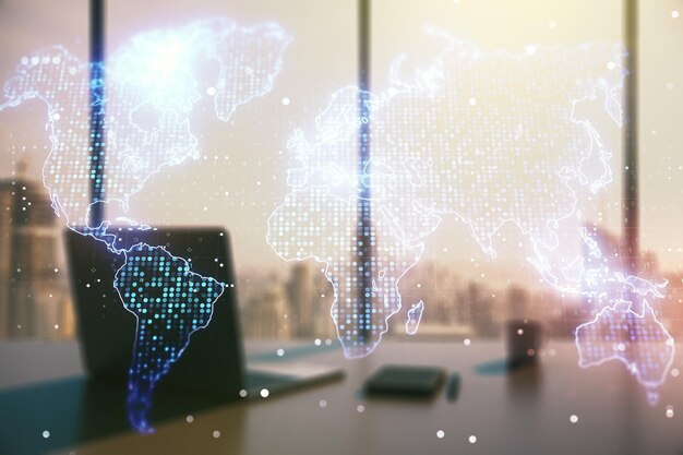 Exposición múltiple de abstractos mapas digitales creativos del mundo y escritorio moderno con portátil en el concepto de investigación y análisis de fondo