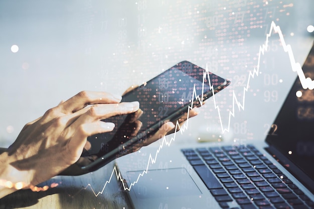 Exposición múltiple de diagrama financiero abstracto con mapa mundial y trabajo manual con una tableta digital sobre el concepto de banca y contabilidad de fondo