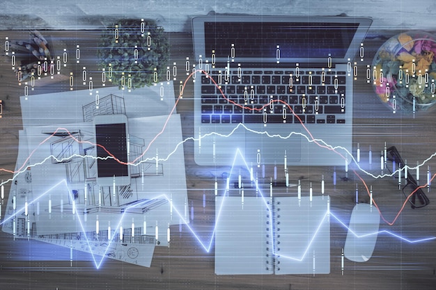 Exposición múltiple del dibujo de gráficos financieros sobre el fondo de la tabla con el ordenador Concepto de investigación Vista superior