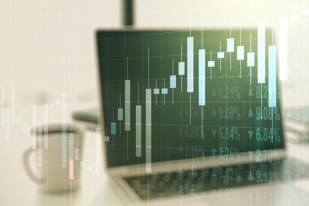 Exposición múltiple del gráfico financiero abstracto en el concepto financiero y comercial de fondo de la computadora portátil