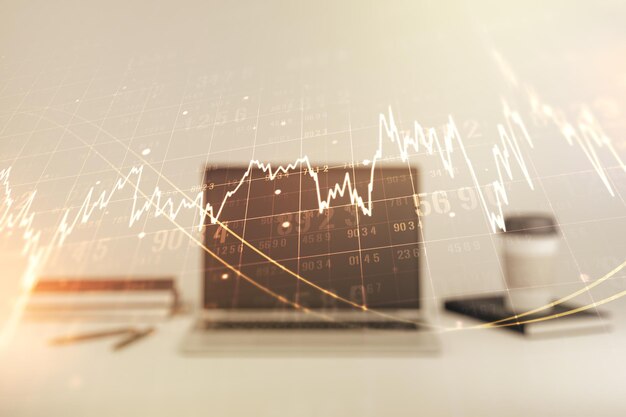 Exposición múltiple de gráficos financieros abstractos en el fondo de la computadora portátil concepto financiero y comercial