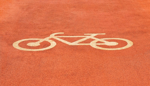 Fahrradschild am roten Radweg oder Pfadhintergrund