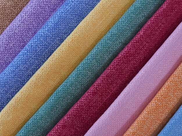 Farbenfroher Hintergrund Ein Stapel farbenfroher Stoffe Vollformat-Aufnahme von mutifarbenem Stoffhintergrund