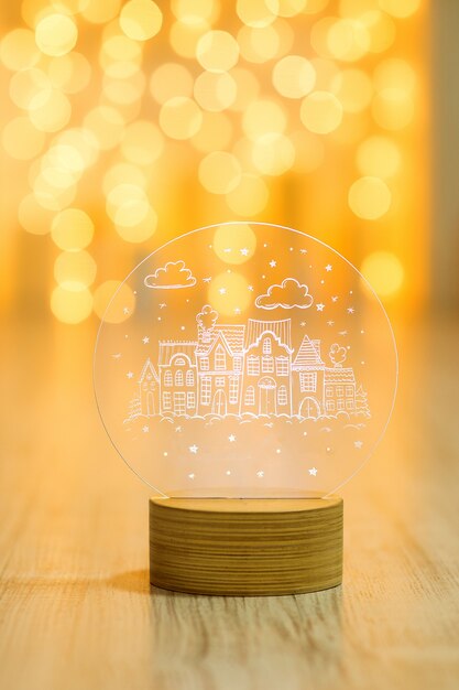 Farol decorativo de cristal con motivo de Año Nuevo en un cálido