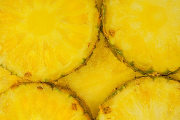 Fatias amarelas suculentas de abacaxi como fundo Vista superior