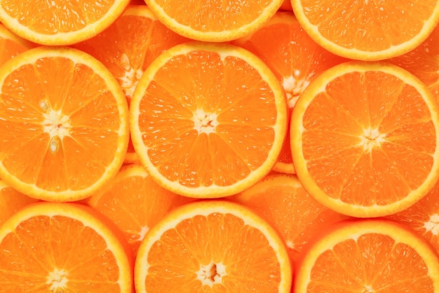 Fatias de laranja como plano de fundo, vista superior.
